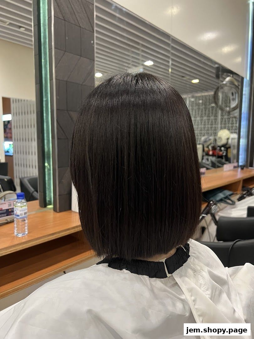 A person with a fresh bob haircut at Pro Trim Hair Salon.