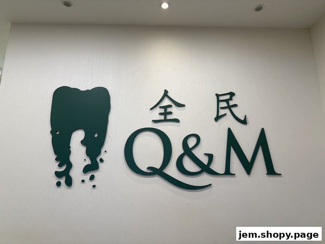 A dental clinic logo with a tooth graphic and the text 'Q & M'.