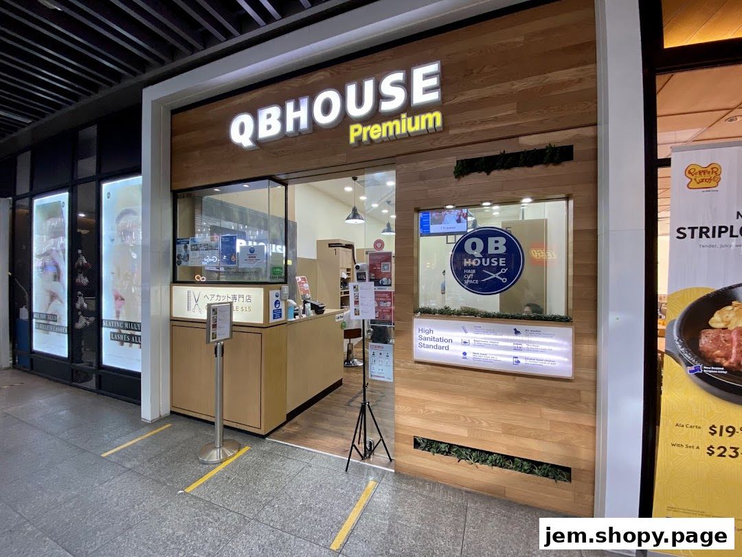 The exterior of QB Premium, a hair salon, with its logo and signage visible.