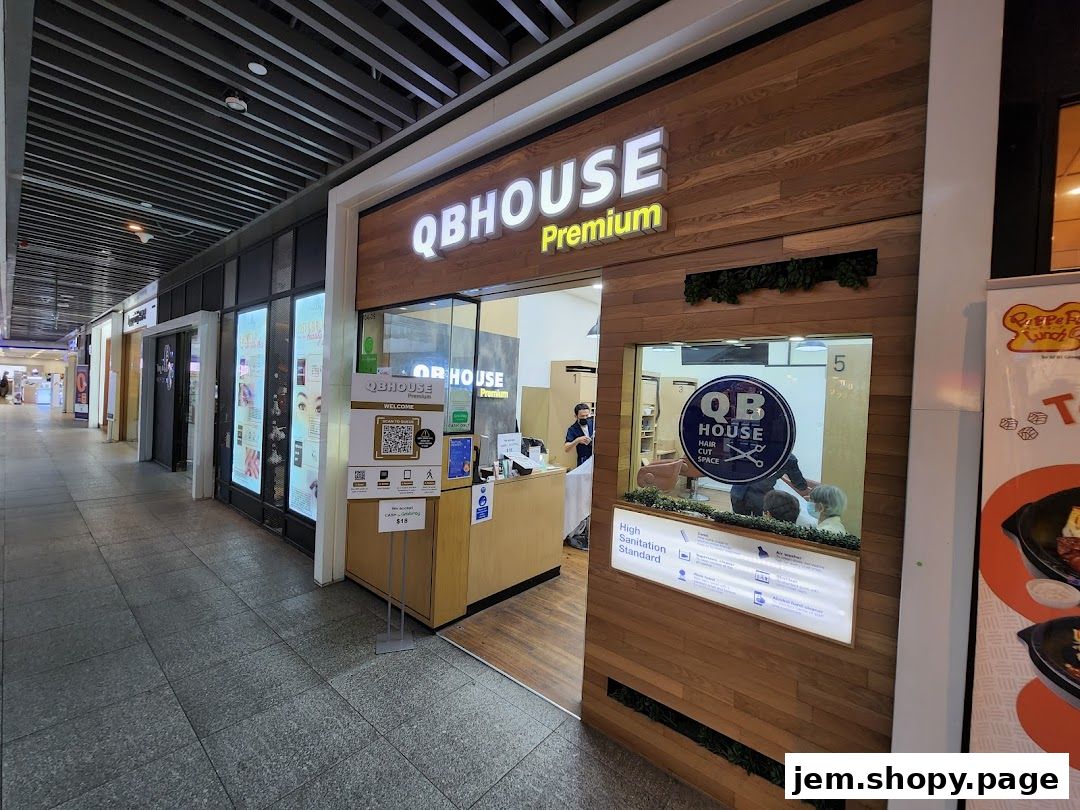 The exterior of QB Premium Jem, a hair salon with a modern wooden facade and interior view.