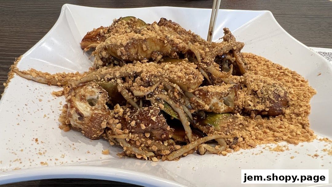 A plate of Rojak, a traditional Malaysian salad, generously topped with crushed peanuts.