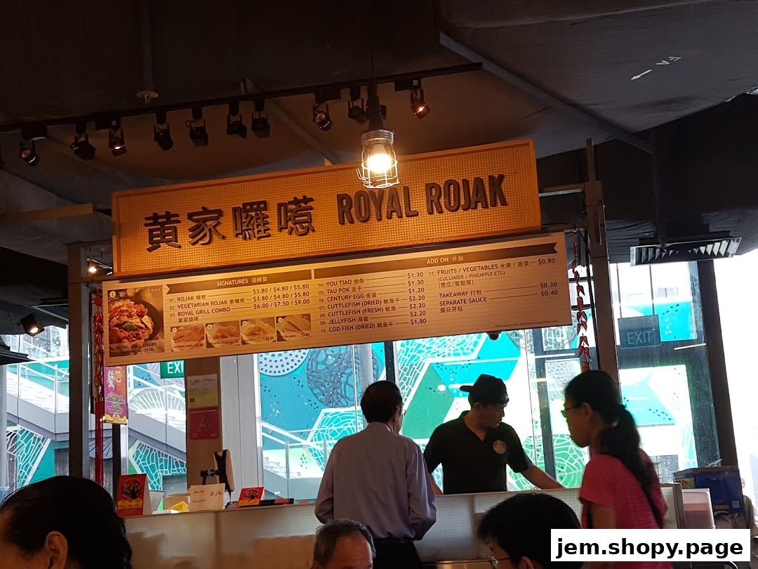 A food stall sign displaying menu items and prices for Royal Rojak.