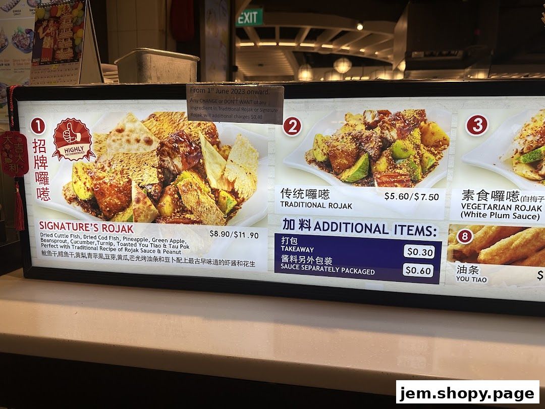 A digital menu board displaying various Rojak dishes and additional items with prices.