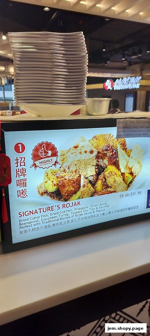A digital menu board displaying a signature Rojak dish with ingredients and price.