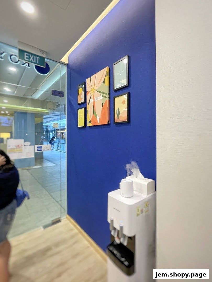 Interior view of Royce Dental Surgery with artwork and a water dispenser.