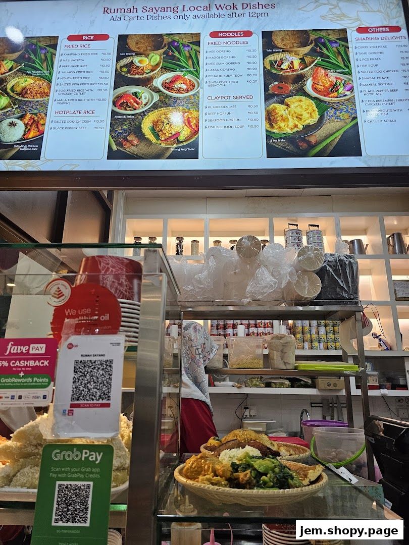 A menu board for Rumah Sayang Local Wok Dishes, featuring rice, noodles, and other delights.