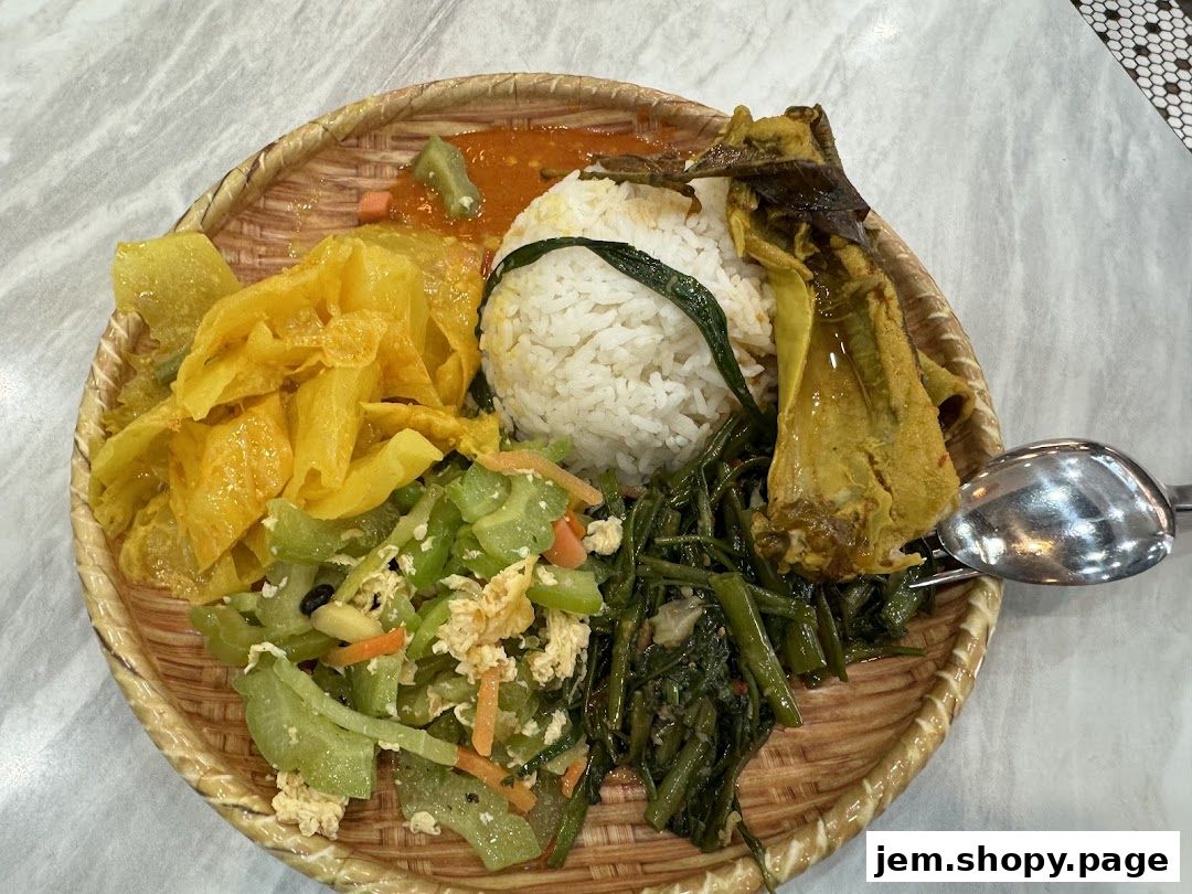 A woven plate filled with rice, curry, vegetables, and crispy snacks.