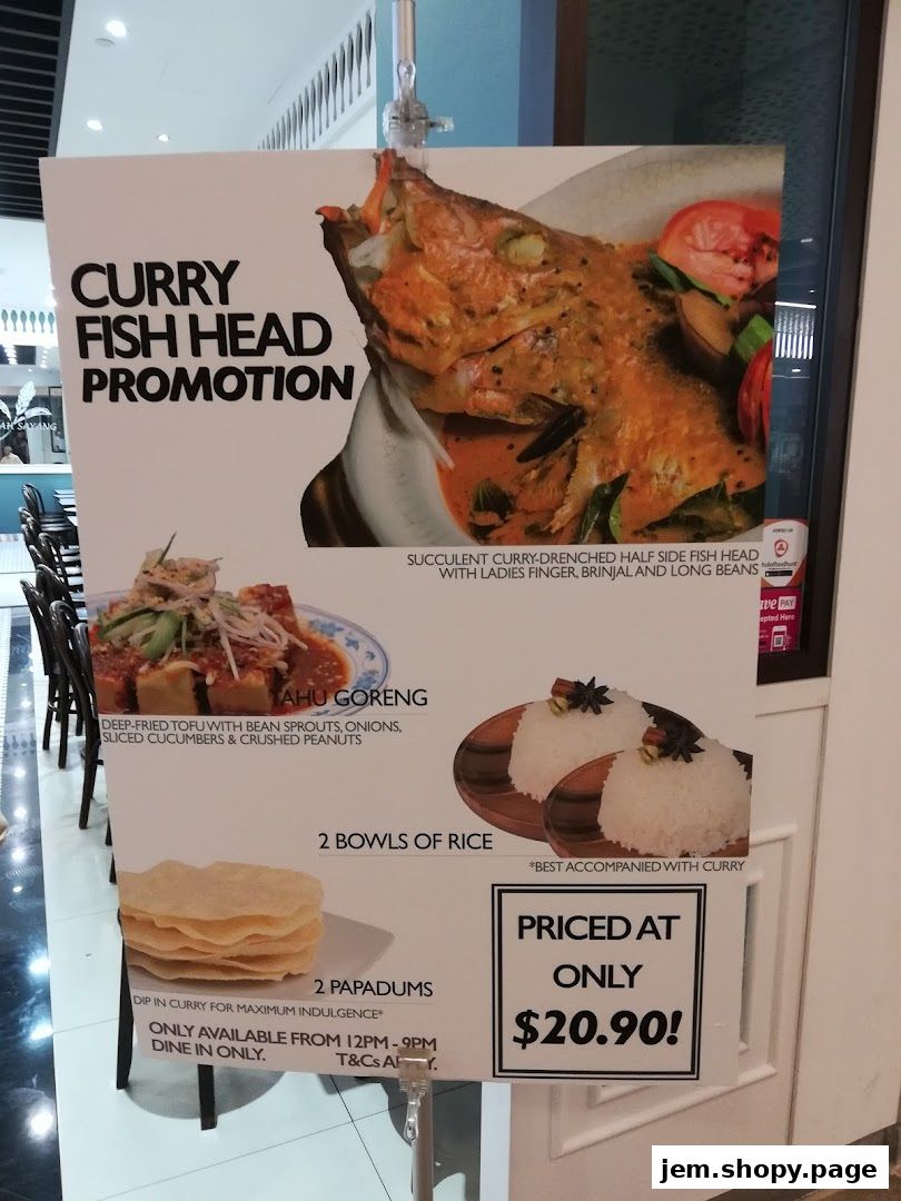 A promotional poster for Curry Fish Head featuring images of the dish, tofu goreng, rice, and papadums.