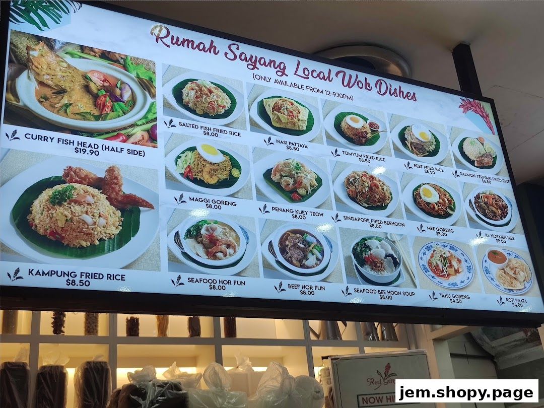 A digital menu board displaying various local wok dishes with images and prices.