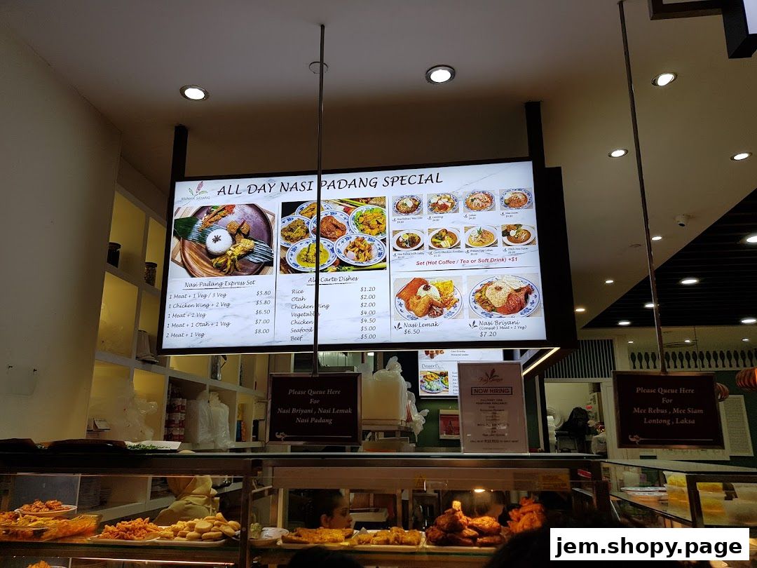 A digital menu board displays Nasi Padang specials and a la carte dishes with prices.