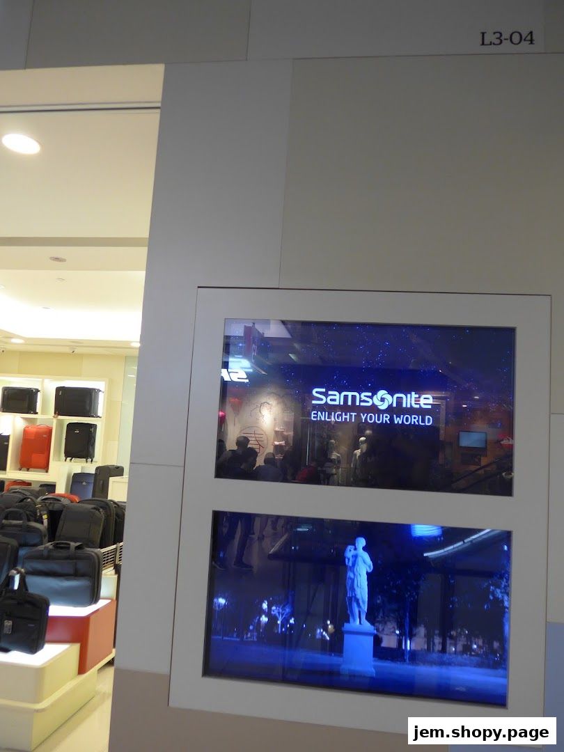 Samsonite store display featuring luggage and digital screens with store branding.