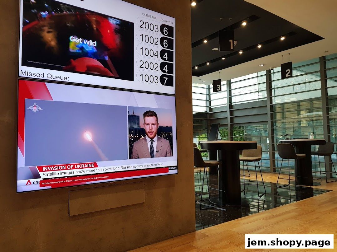A Samsung Service Centre with a queue display and waiting area.