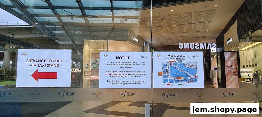Mall entrance with notices about access closure and alternative routes.