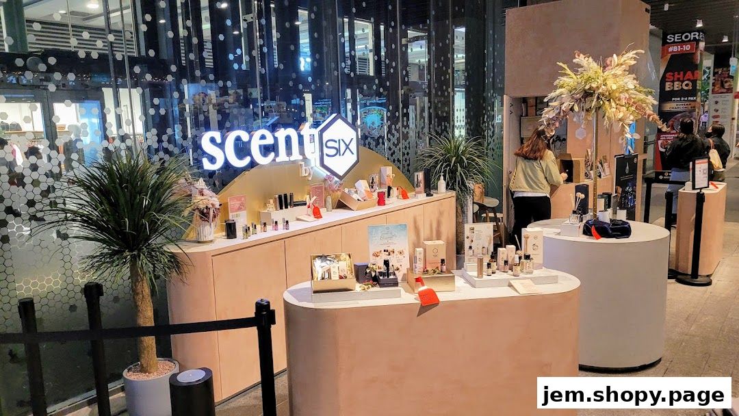 The Scent by SIX Jem shop front displays various perfumes and home fragrance products.