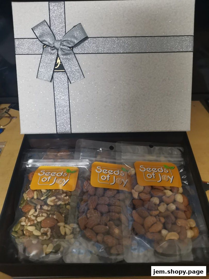 A gift box filled with three bags of assorted nuts and seeds from Seeds of Joy.