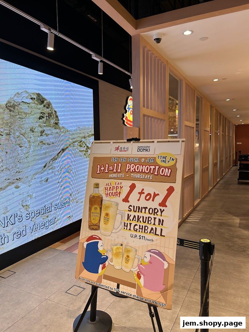 A promotional sign for Sen Sen Sushi Jem by DON DON DONKI Singapore advertising a 1-for-1 promotion.
