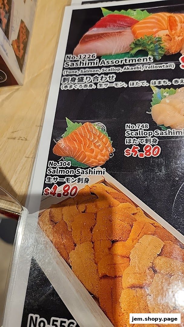 A menu featuring various sashimi dishes, including salmon and scallop.