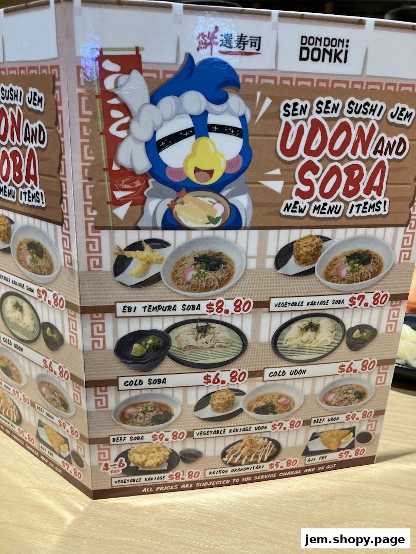 A menu display for Sen Sen Sushi Jem featuring Udon and Soba new menu items.