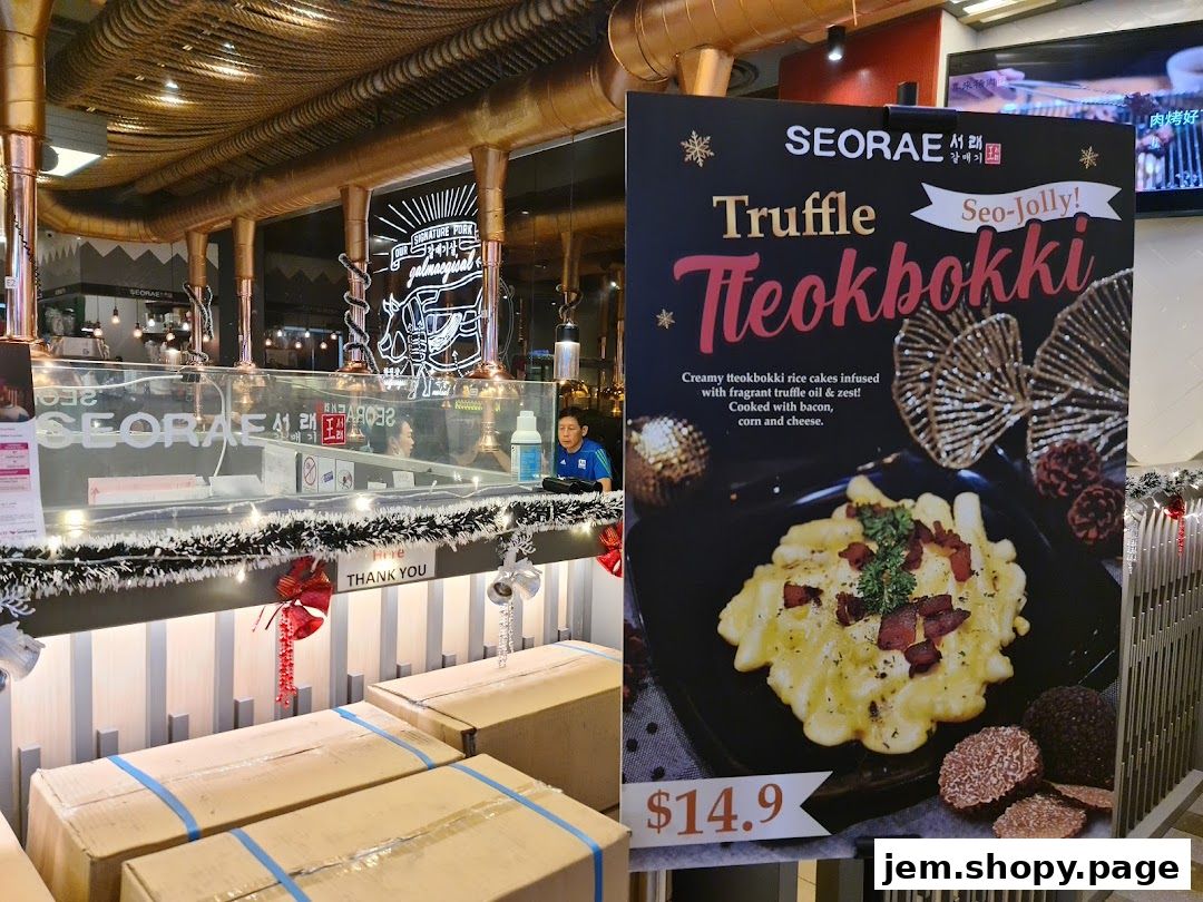 A sign advertises Truffle Tteokbokki at SEORAE restaurant, with a picture of the dish.