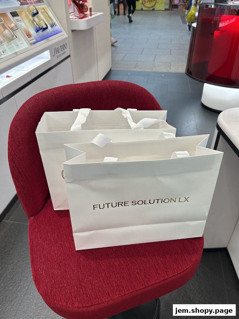 Shiseido shopping bags on a red chair inside a store.