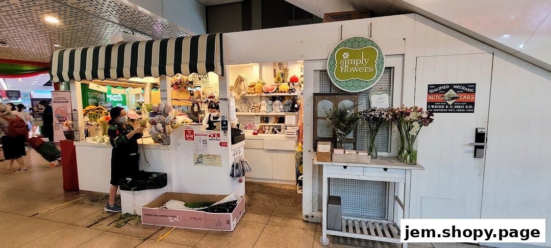 A flower shop with a display of flowers, plush toys, and a cashier counter.