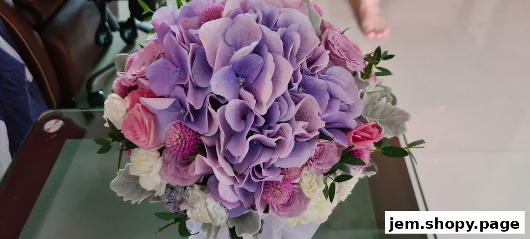 A beautiful bouquet of purple hydrangeas, pink roses, and white flowers.