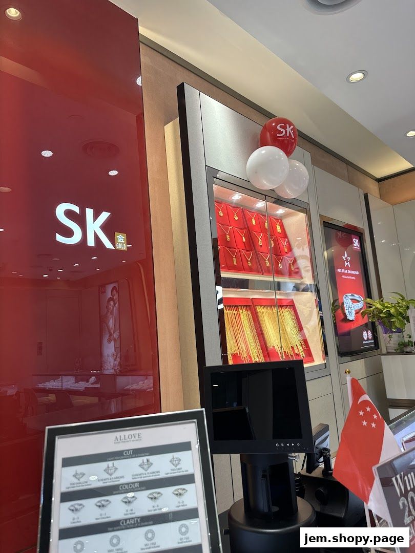 SK Gold JEM shop interior showcasing gold necklaces and diamond information display.