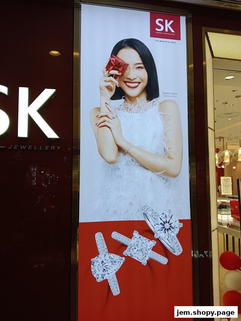 A large advertisement for SK Jewellery featuring a smiling woman and sparkling diamond rings.
