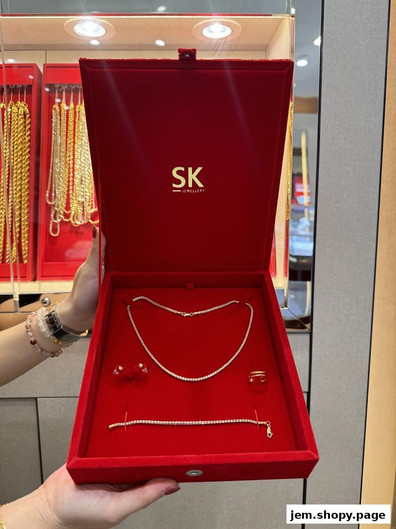 A red velvet jewelry box displaying a diamond necklace, earrings, ring, and bracelet.