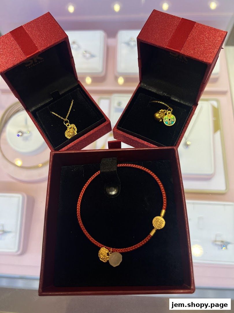 Exquisite gold jewelry, including necklaces and bracelets, displayed in elegant red gift boxes.