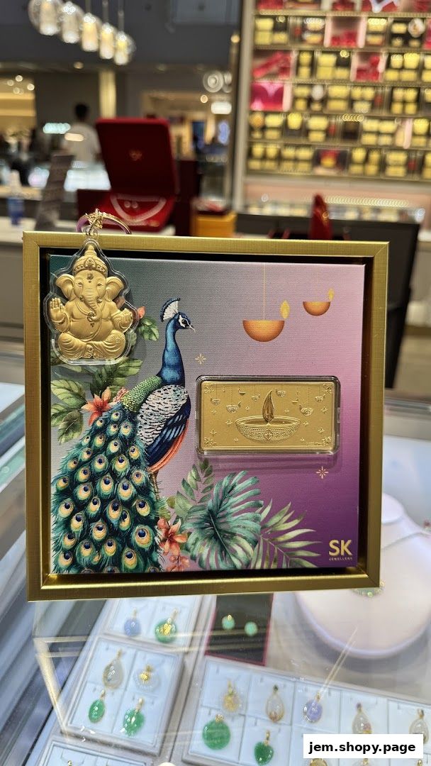 A decorative display featuring a gold Ganesha charm, a peacock, and a gold bar with Diwali lamps.