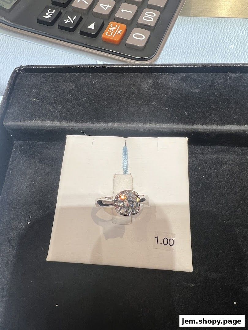 A sparkling diamond ring is displayed on a white card with a price tag.