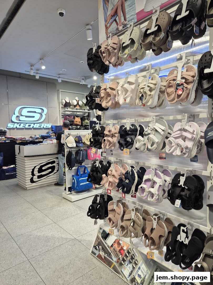 Interior view of a Skechers store showcasing a wide variety of sandals and footwear.