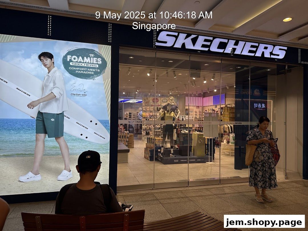 The Skechers store front with a large advertisement and mannequins displaying shoes.