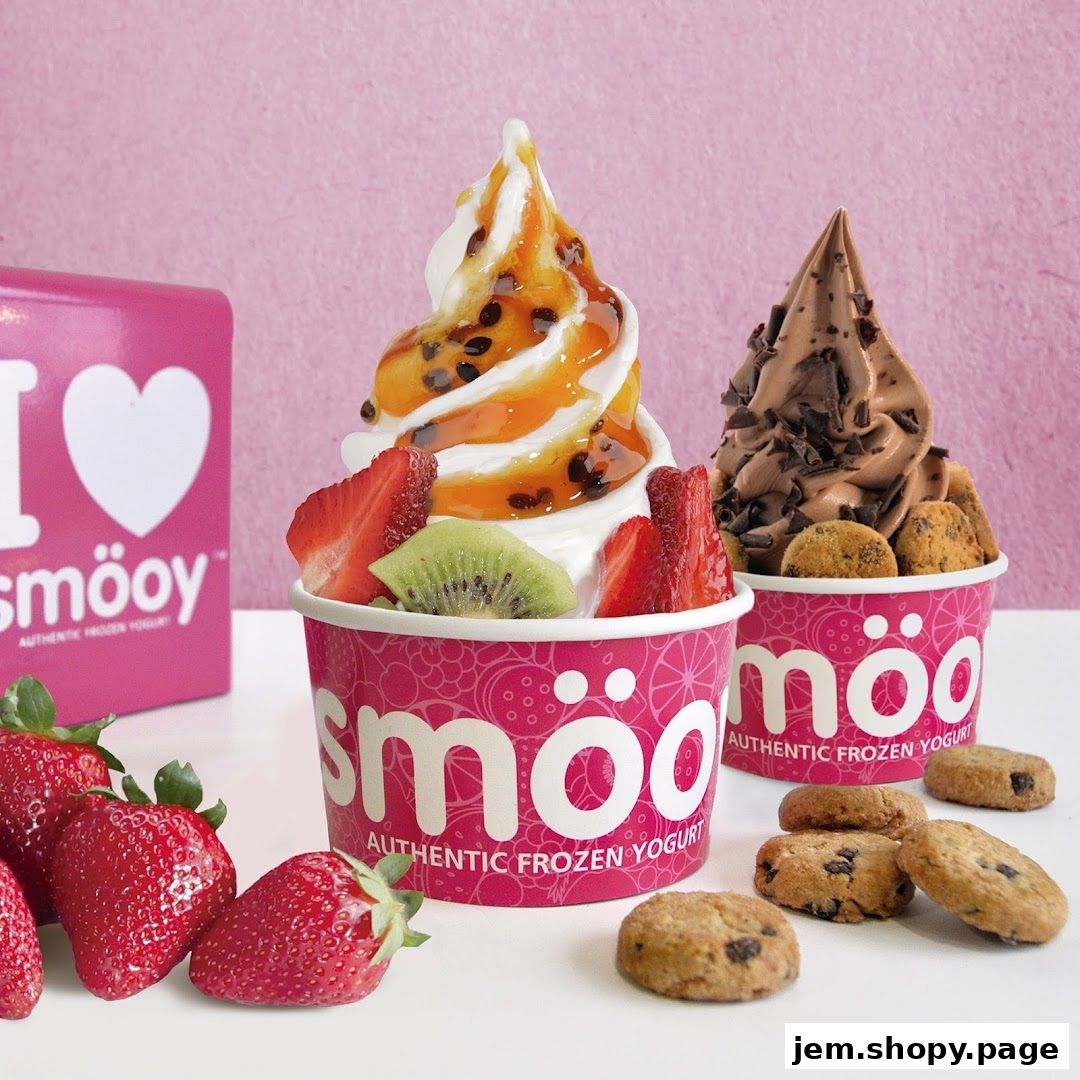 Two cups of authentic frozen yogurt with fruit and cookie toppings, plus fresh strawberries.