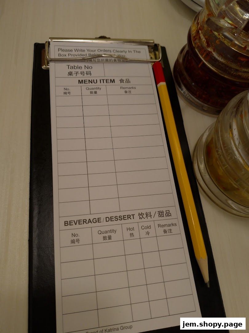 A menu order form with columns for item, quantity, and remarks, along with a pencil.