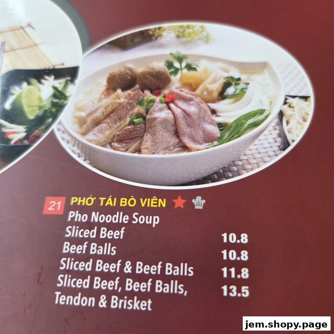 A close-up of a menu item featuring Pho Noodle Soup with various beef cuts and beef balls.