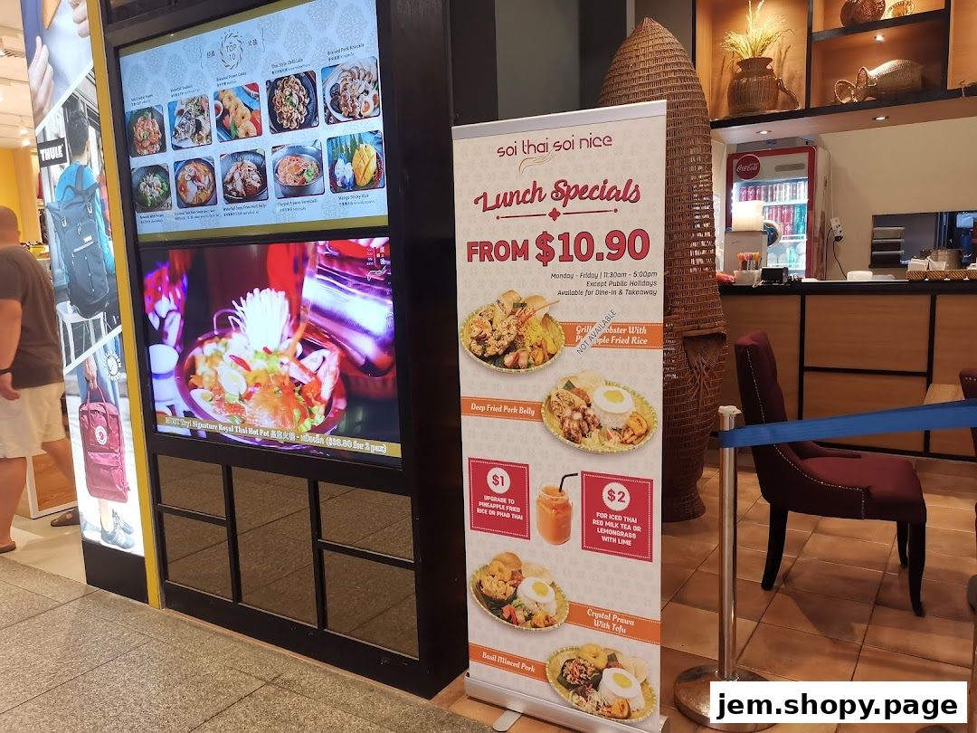 A digital menu board and a lunch specials banner for Soi Thai Soi Nice.