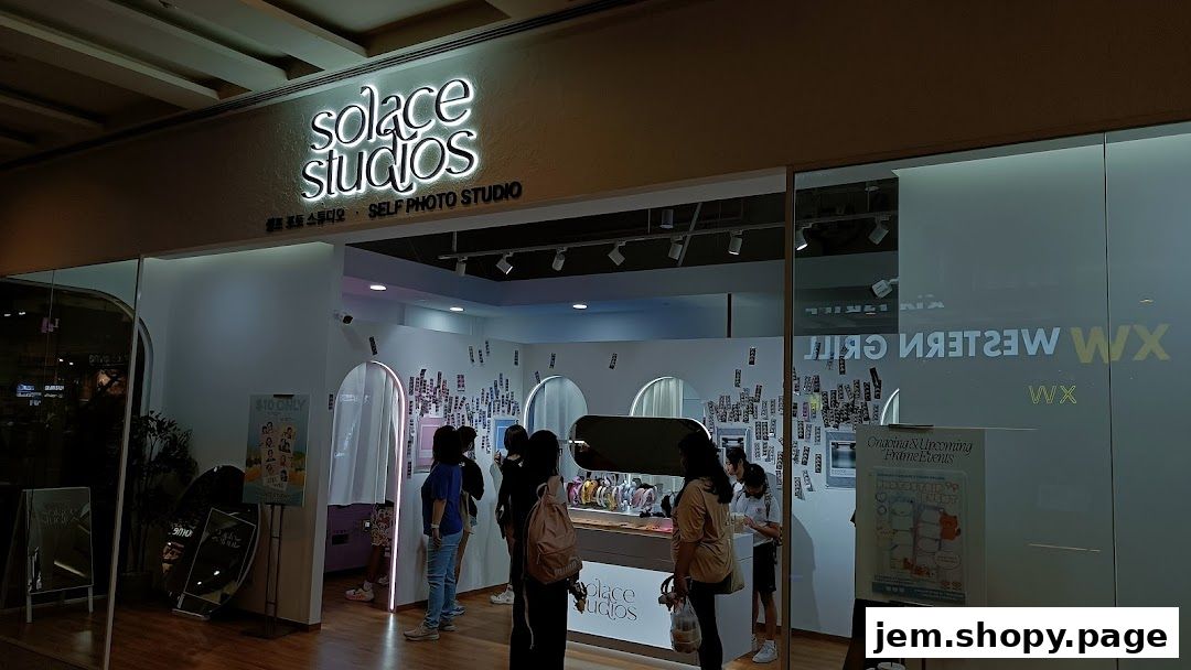 Solace Studios, a self-photo studio, with customers inside and promotional posters.