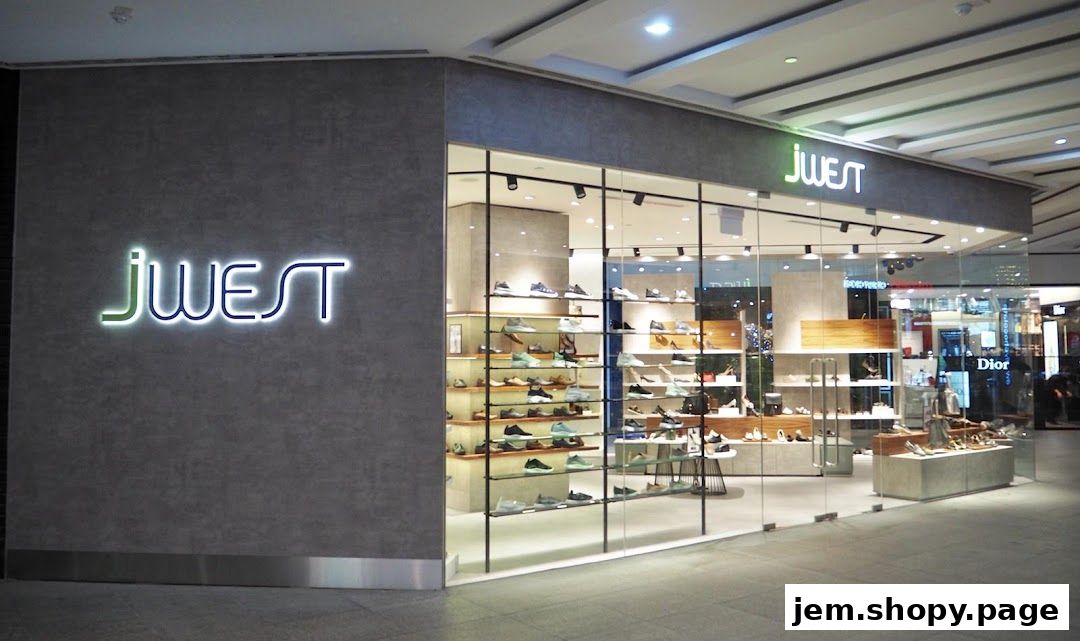 The exterior of a modern shoe store named JWEST, showcasing a wide selection of footwear.