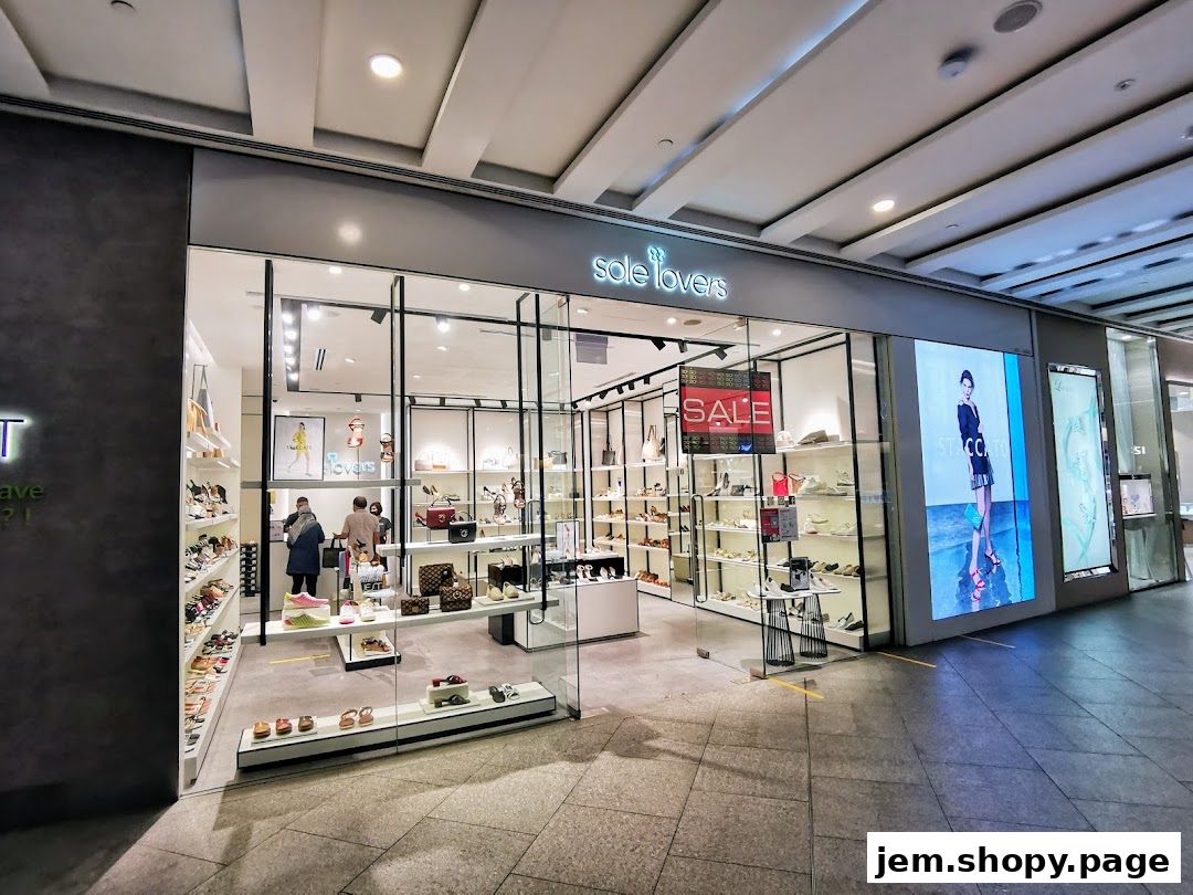 The exterior of a shoe store named Sole Lovers, showcasing various footwear and a sale sign.