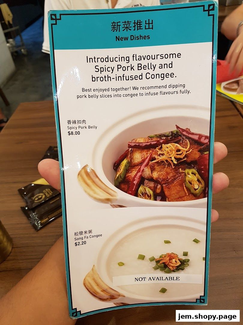 A menu showcasing new dishes, including spicy pork belly and congee.