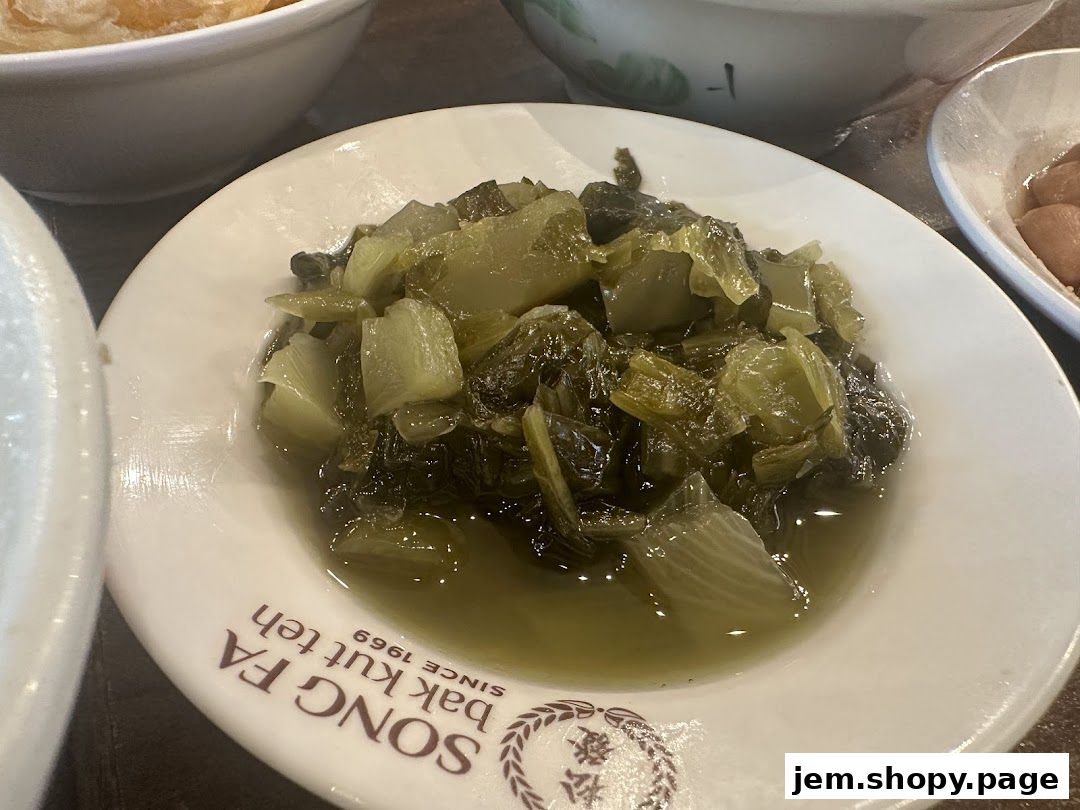A close-up of a bowl of braised mustard greens at Song Fa Bak Kut Teh.