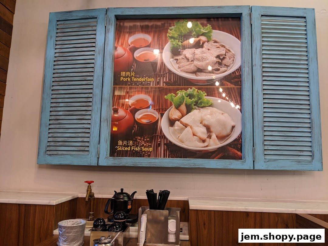A framed display showcasing two popular dishes: Pork Tenderloin and Sliced Fish Soup.