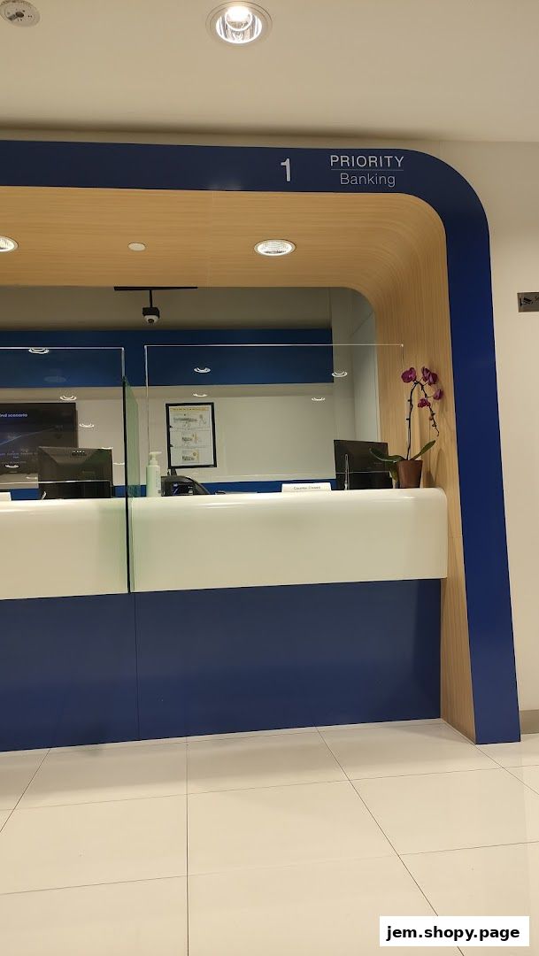 Interior view of a Standard Chartered Bank priority banking counter with glass partitions.