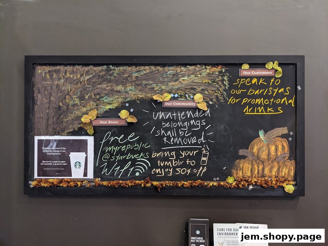 A chalkboard sign at Starbucks with fall-themed drawings and promotional messages.