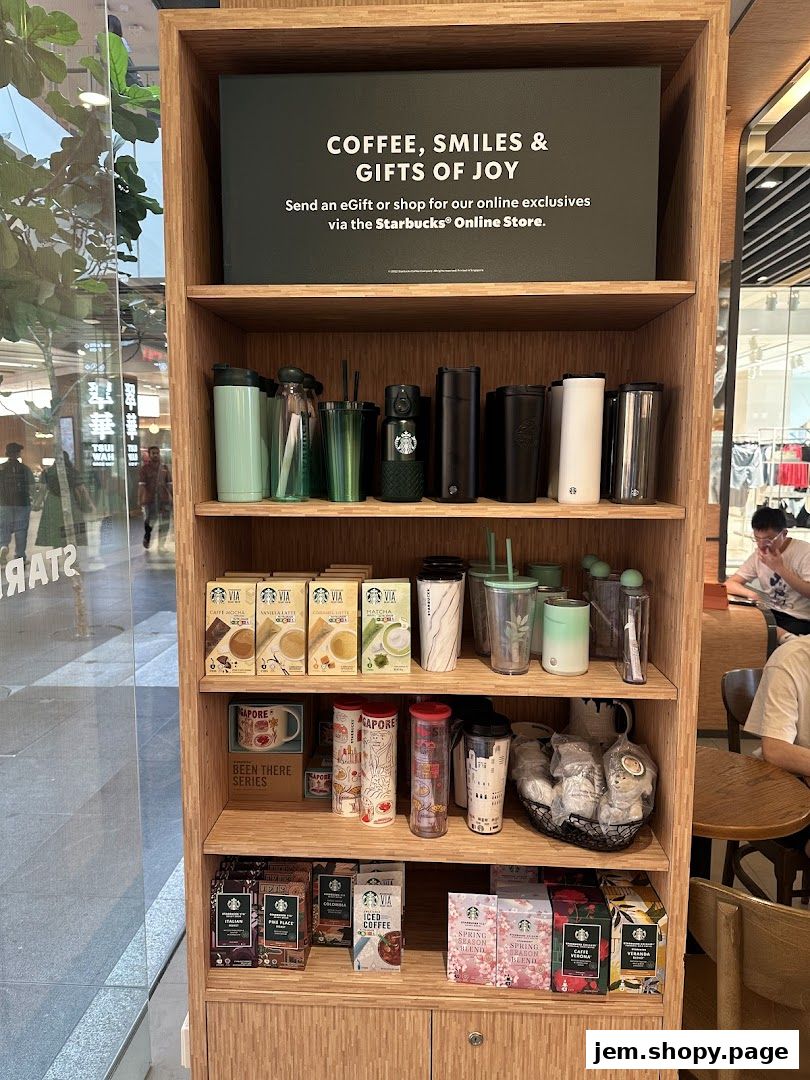 Starbucks merchandise display featuring tumblers, coffee, and gifts.