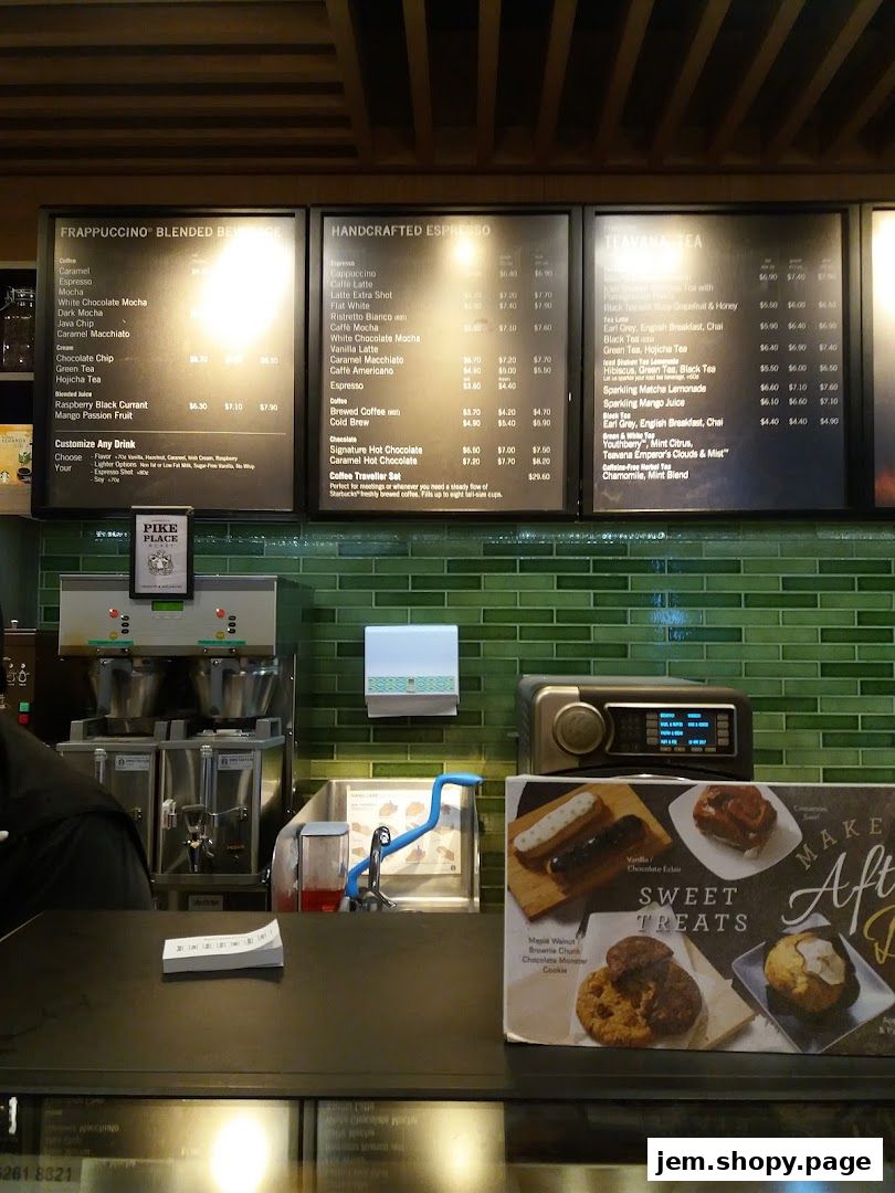Starbucks menu boards displaying Frappuccino, Espresso, and Teavana Tea drinks.