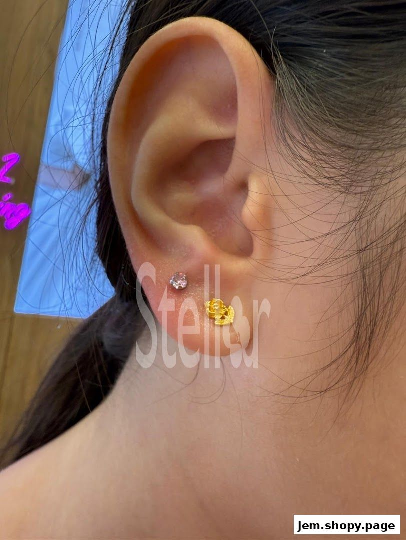 Close-up of a person's ear with two stylish earrings, showcasing Stellar Jem's jewelry.
