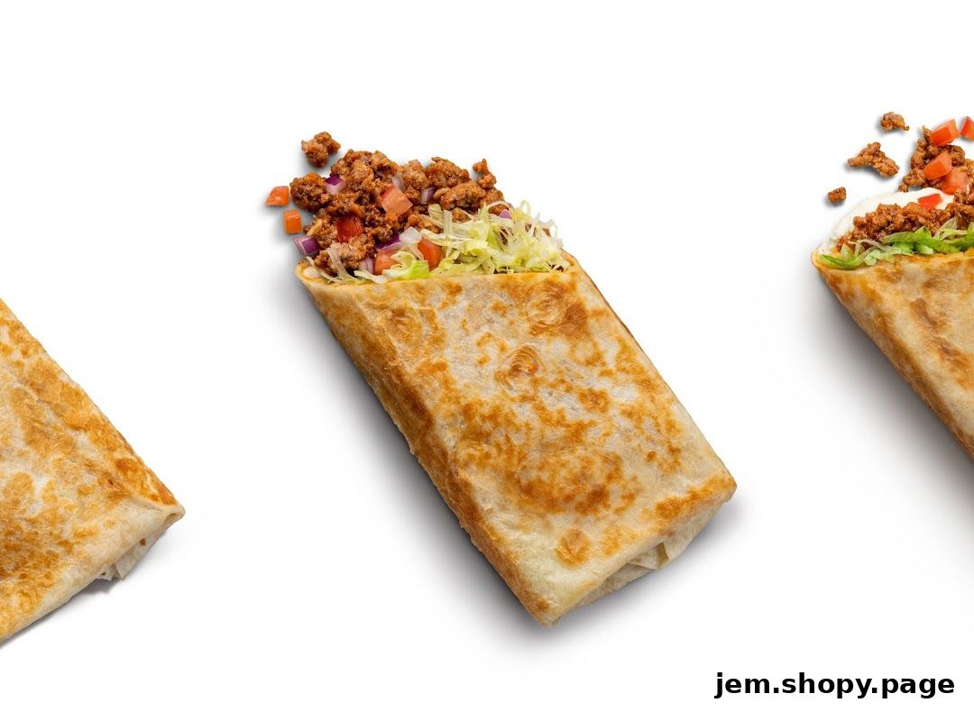 Three delicious burritos filled with seasoned meat, lettuce, tomatoes, and onions.